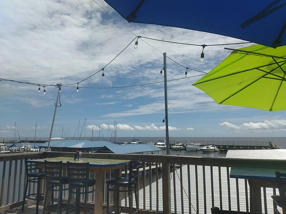 Boats and waterfront dining at Pass Christian Harbor